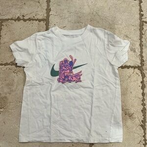This is a Nike tee size medium for girls with a Nike green checkmark with sports